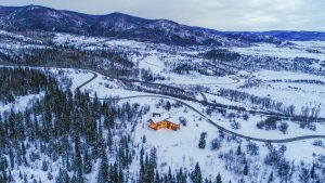 Alpine Mountain Ranch Property Twilight Drone 39 300x169 - Alpine Mountain Ranch & Club Completes 'Moonlight Run' Market Home