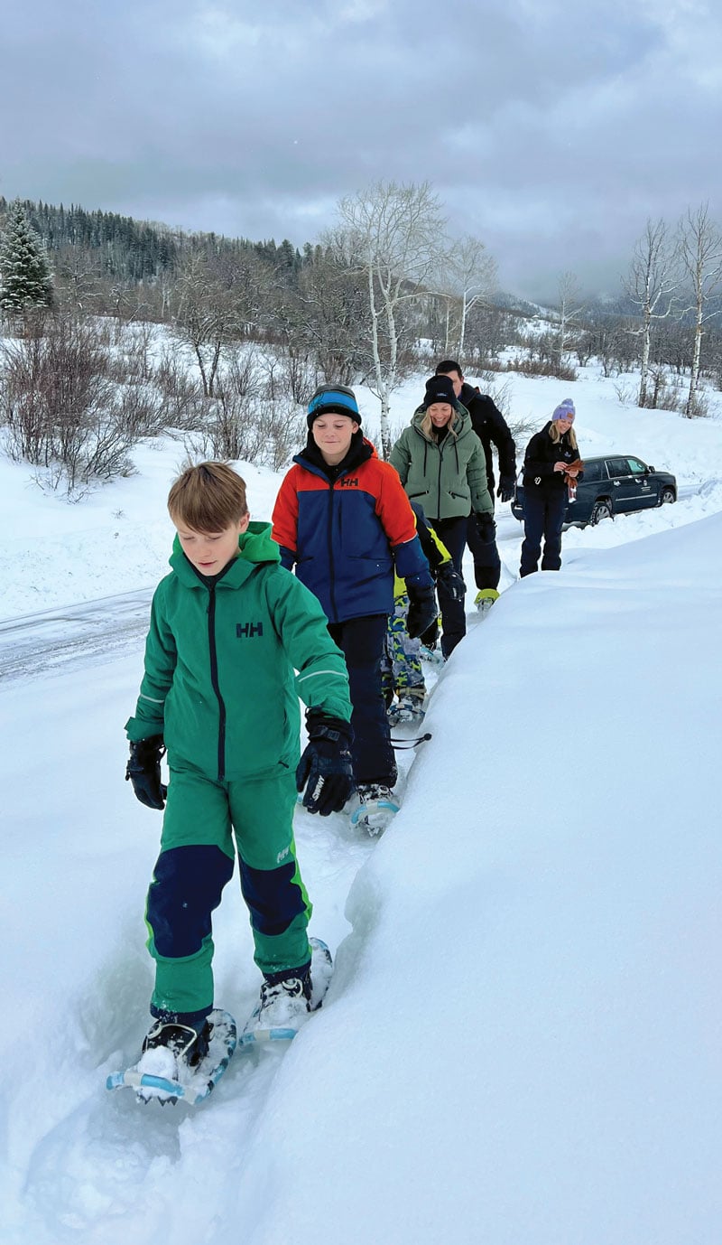 An energetic family tours homesites at Alpine Mountain Ranch.